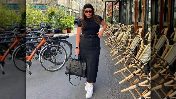 Woman by bikes in denim skirt