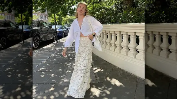 Woman on sidewalk in crochet maxi skirt