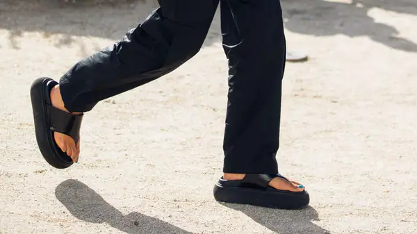 model in chunky flip flops in 2021