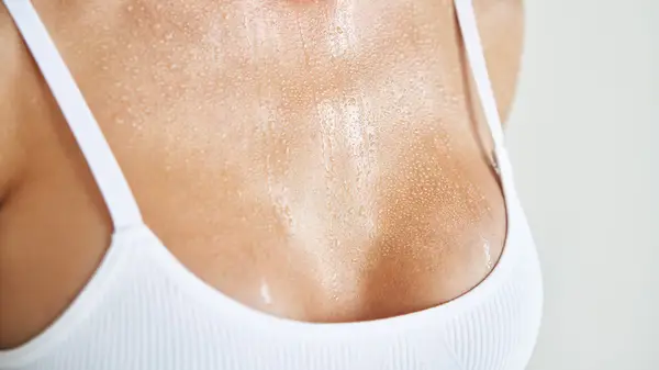 Woman sweating in bra
