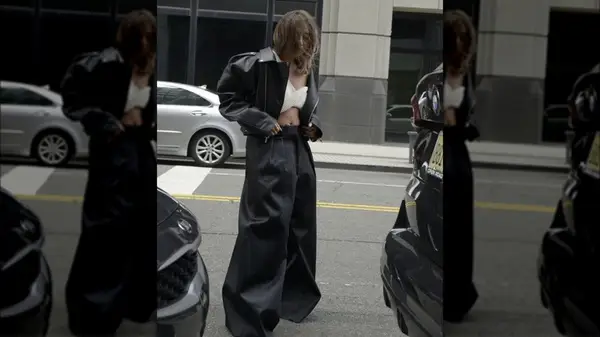 woman posing for photo on a city street