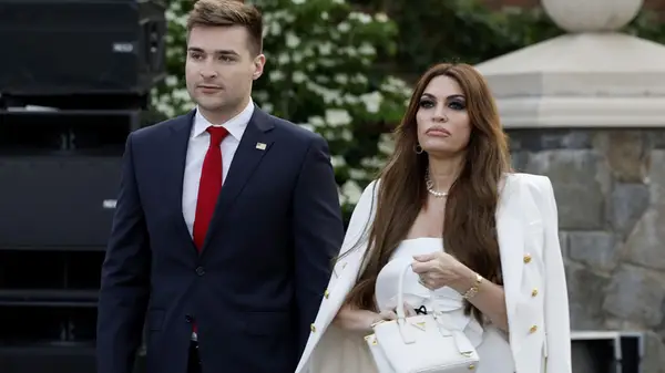 Kimberly Guilfoyle with security in 2023 at Trump