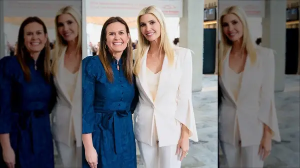 Sarah Huckabee Sanders in a navy dress with Ivanka Trump