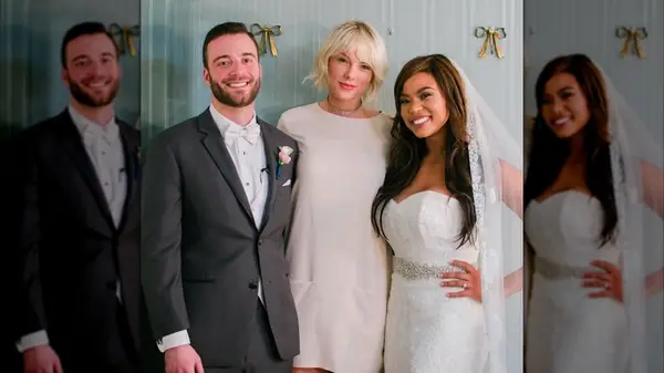 Taylor Swift wearing white and standing with a bride and a groom