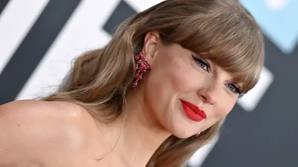 Taylor Swift with Travis Kelce at the Stanley Cup 2025