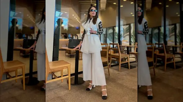 Woman wearing white Mary Jane shoes