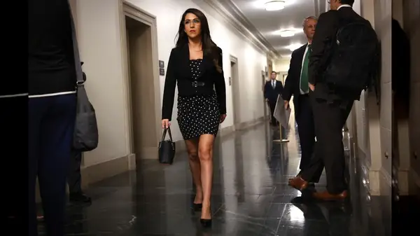 Lauren Boebert walking in a polka dot dress