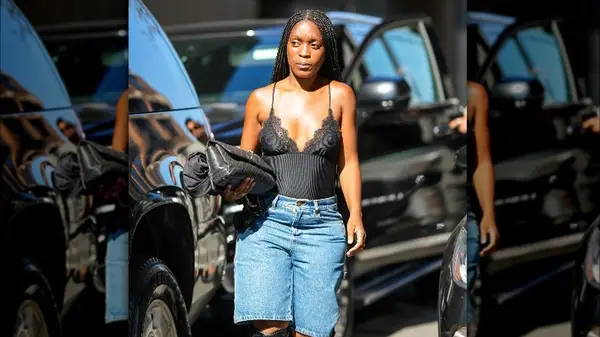 woman wears a lace camisole with jeans 