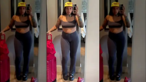 Woman in black athletic ballet flats