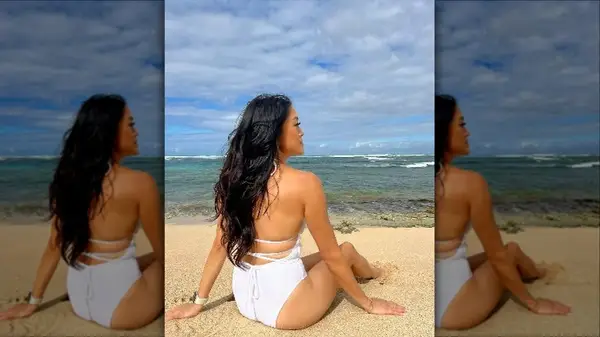 Woman wearing white one-piece