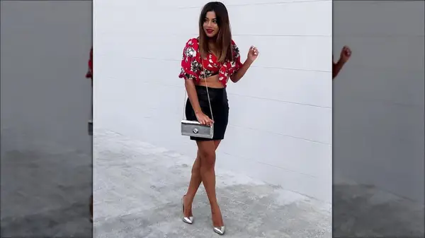 Woman wearing silver shoes with silver bag