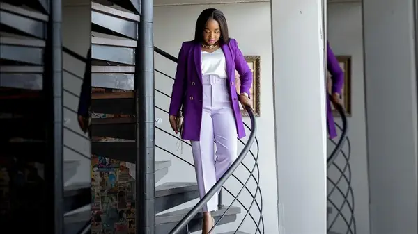 Woman carrying a clutch