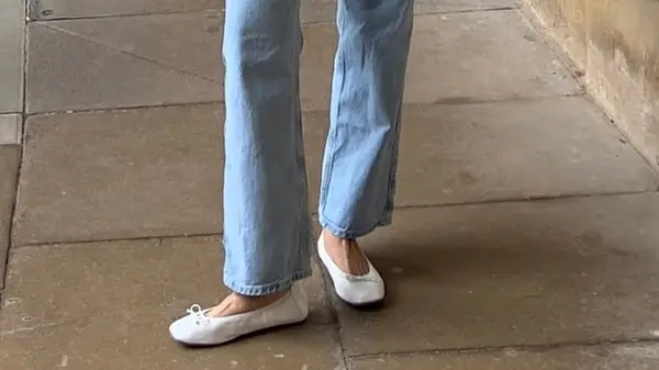 A woman in basic ballet flats