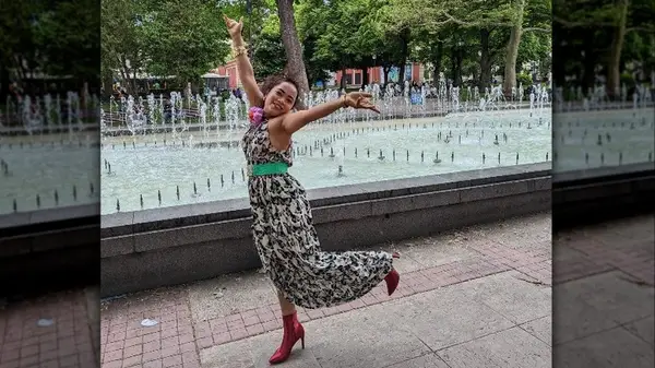 Woman in front of fountain