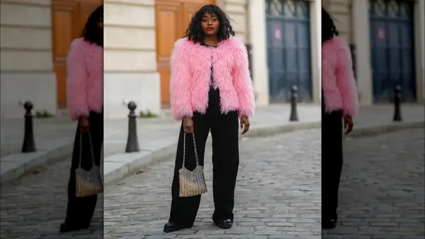 A woman in a pastel pink coat 