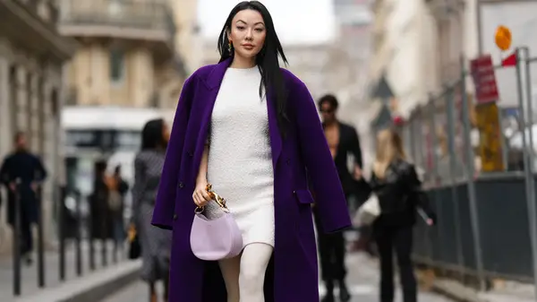 Fashionable woman walking on street