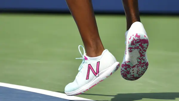 Close-up of feet in tennis shoes