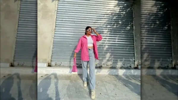 Woman wearing a pink oversized shirt