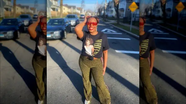 Woman wearing Whitney Houston shirt