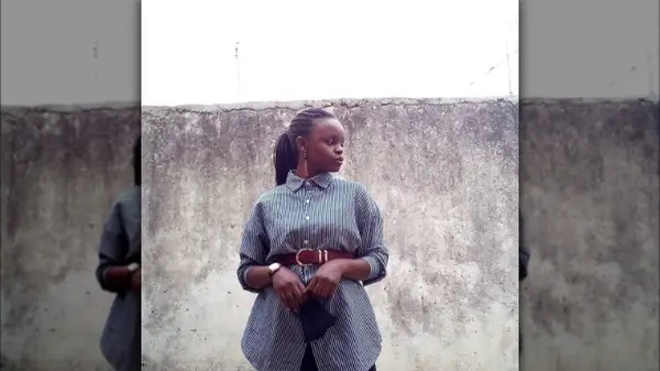 Woman in an oversized striped shirt