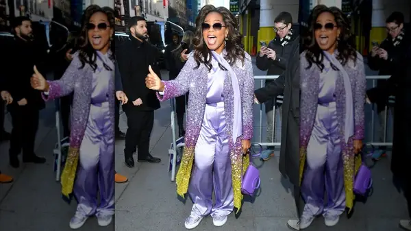 Oprah wearing a glittery purple and yellow coat in 2023