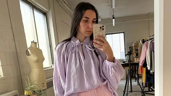 A woman in a lilac blouse