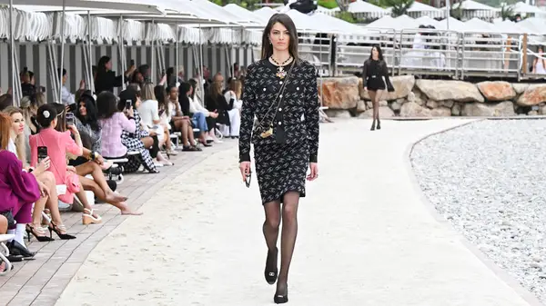 Models walk the runway at the Chanel Cruise 2023 fashion show