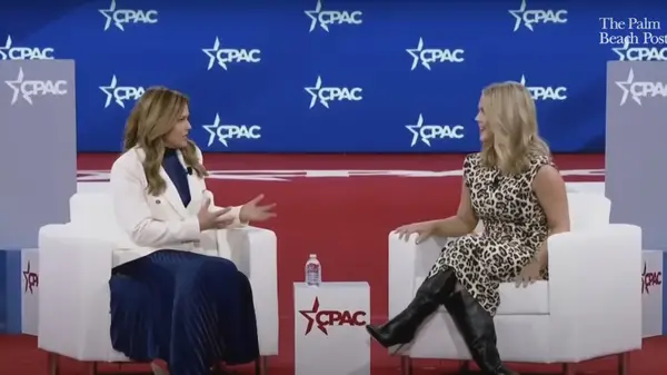 karoline leavitt in leopard print dress during CPAC interview