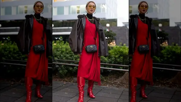 A woman in red dress and brown coat 