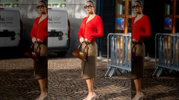 A woman in a red cardigan 