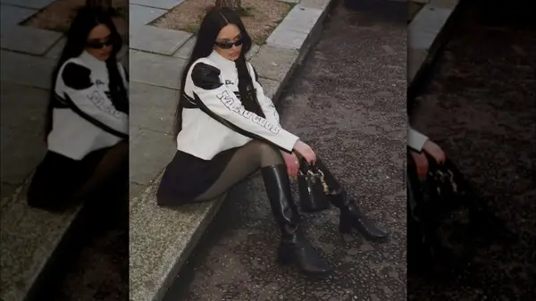 Woman wearing moto jacket and boots