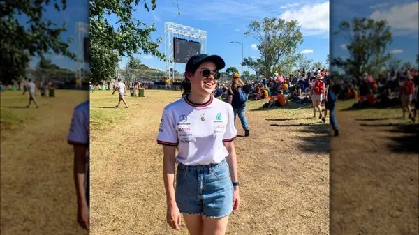 Woman wearing F1 top