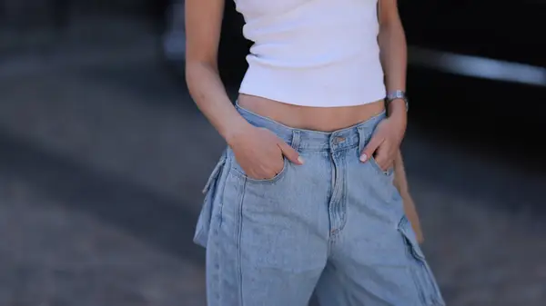 Low cut denim and a tank top