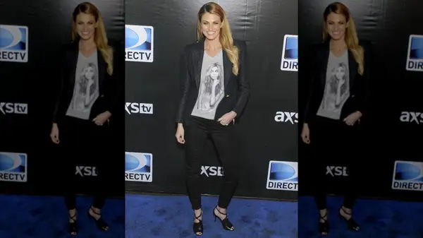 Erin Andrews wearing a graphic tee and blazer at a DirecTV event