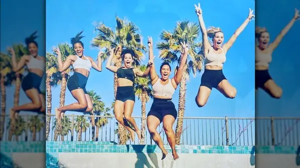 Sara Moylan and other women in SHEFIT jumping and posing