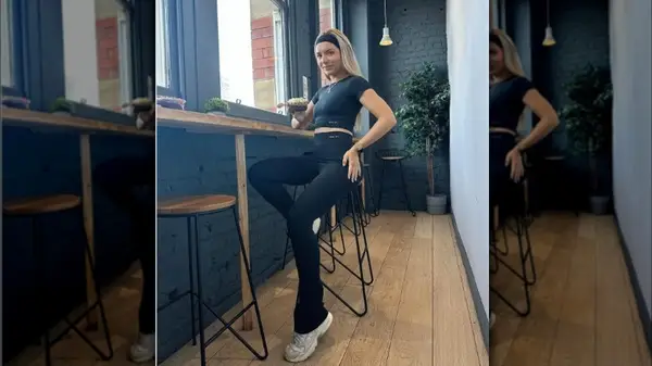 Elinorfayx poses in flared leggings 