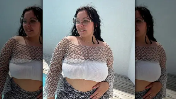 Woman in crocheted net shrug