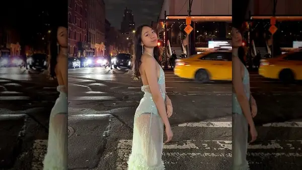 Woman in sheer, shiny, blue dress