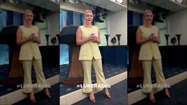 Screen grab of Karoline Leavitt wearing a monochrome, yellow outfit