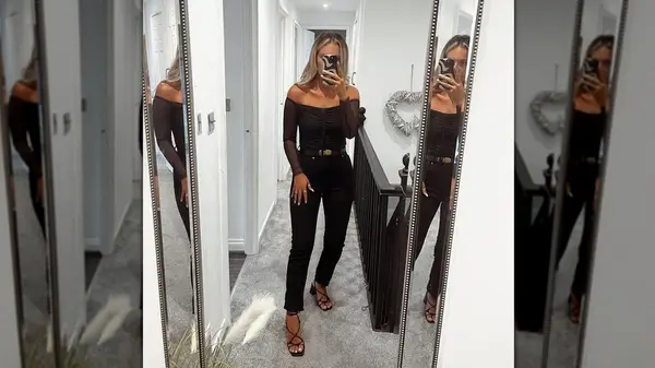 Wearing all-black outfit