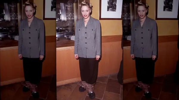 Gwen Stefani at a Rolling Stones concert wearing a blazer and baggy pants
