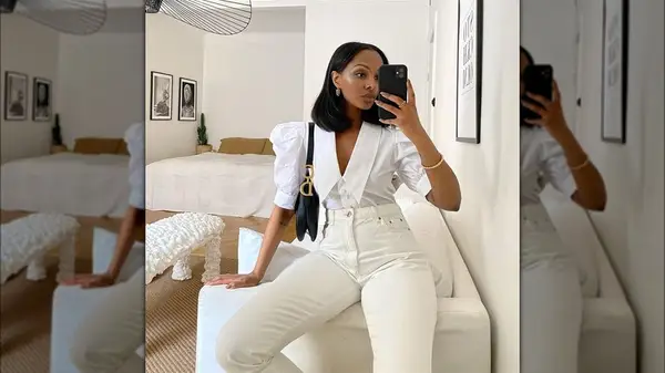 Woman in high-waisted white pants