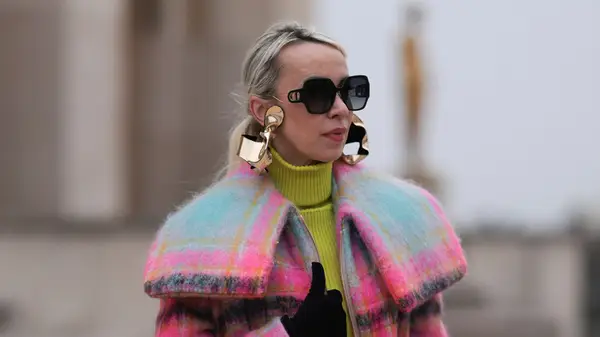 A woman in oversized earrings 