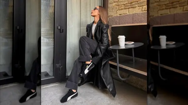 Woman wearing Puma Speedcats with black pants