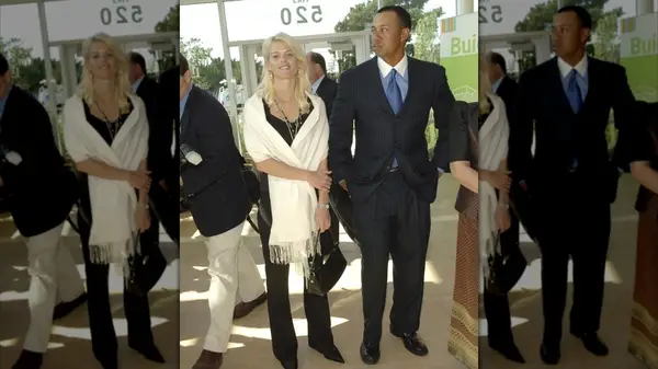 Elin Nordegren wearing a cream wrap, with Tiger Woods in 2006