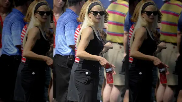 Elin Nordegren in an all black outfit wearing a Nike athletic headband