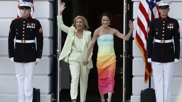Jill Biden with her daughter wearing a monochrome pastel green ensemble