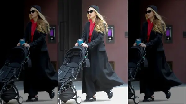 Jennifer Lawrence in a hoodie and trench coat