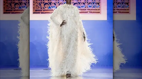 model in white sparkly mumu