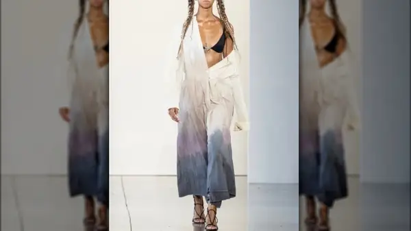 artfully died jumpsuit on runway model